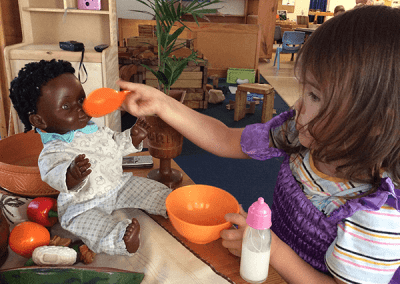 playing with dolls at childcare Mayfield